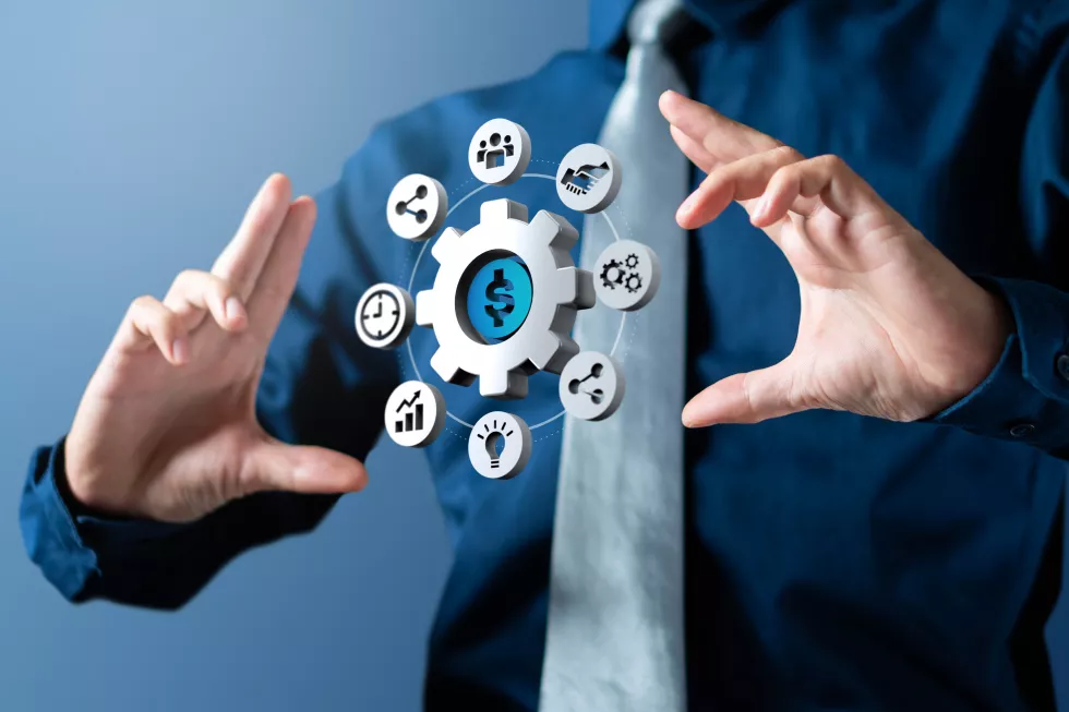 businessman-shows-cogwheel-management-circle