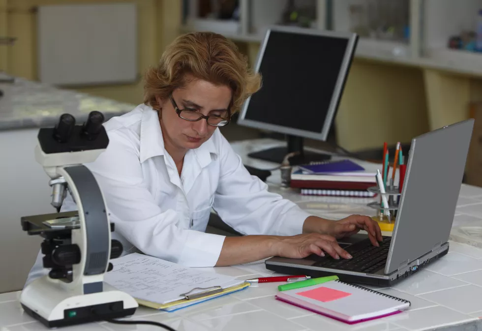scientist-working-laptop-table(3)