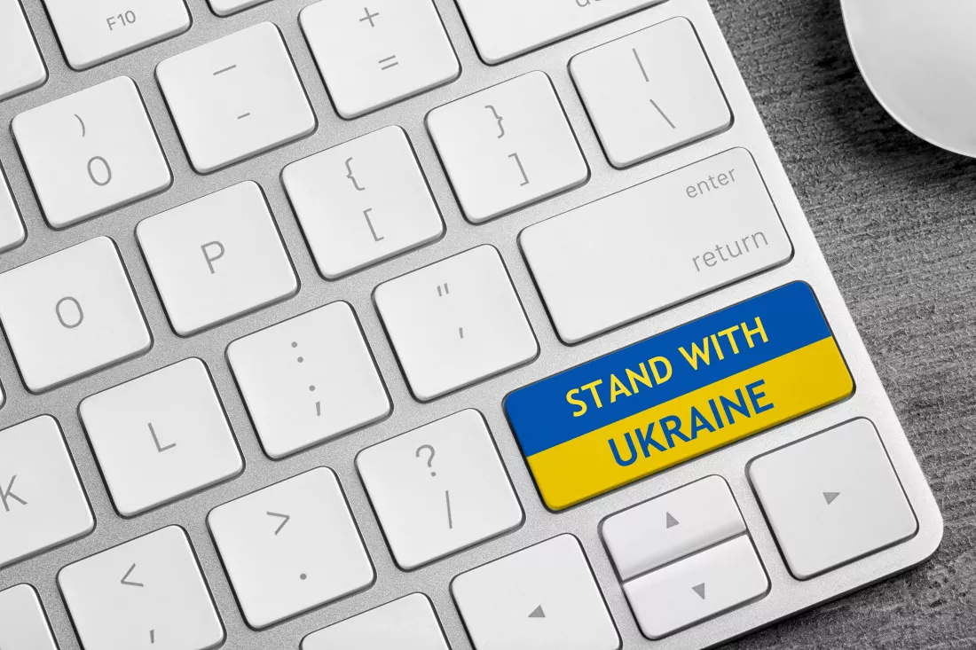 button-colors-ukrainian-flag-with-phrase-stand-with-ukraine-keyboard-closeup-view