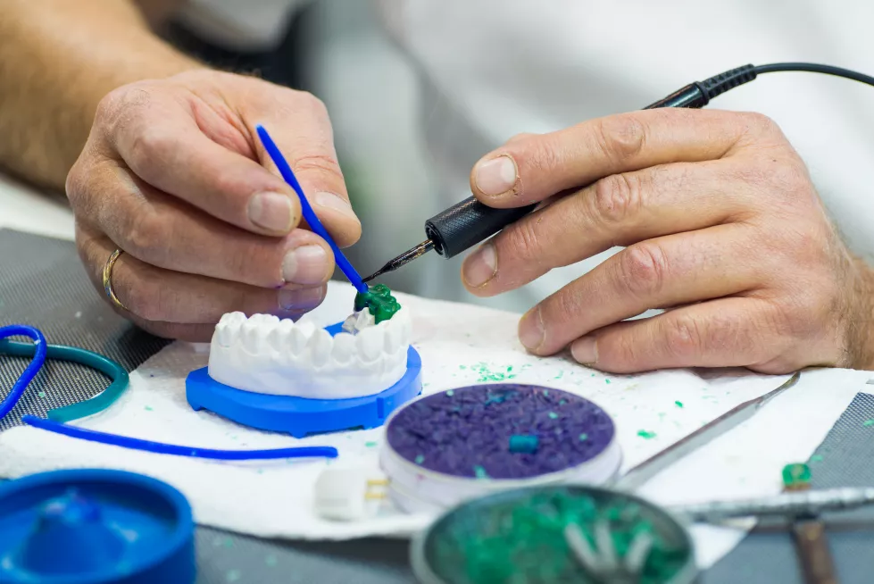 midsection-dentist-filling-dentures-table-clinic