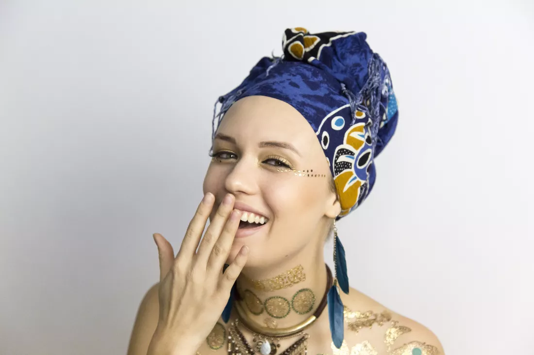 close-up-portrait-young-woman-laughing-while-standing-against-gray-background