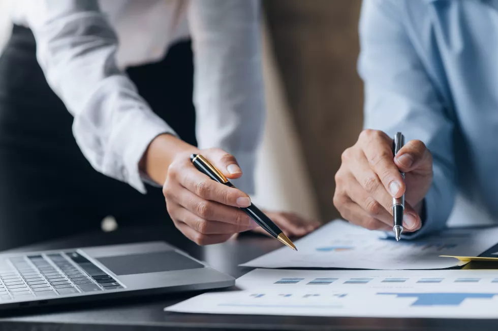 two-businessmen-pointed-material-meeting-working-together-plan-develop-solve-common-business-problems-concept-business-management-growth-quality