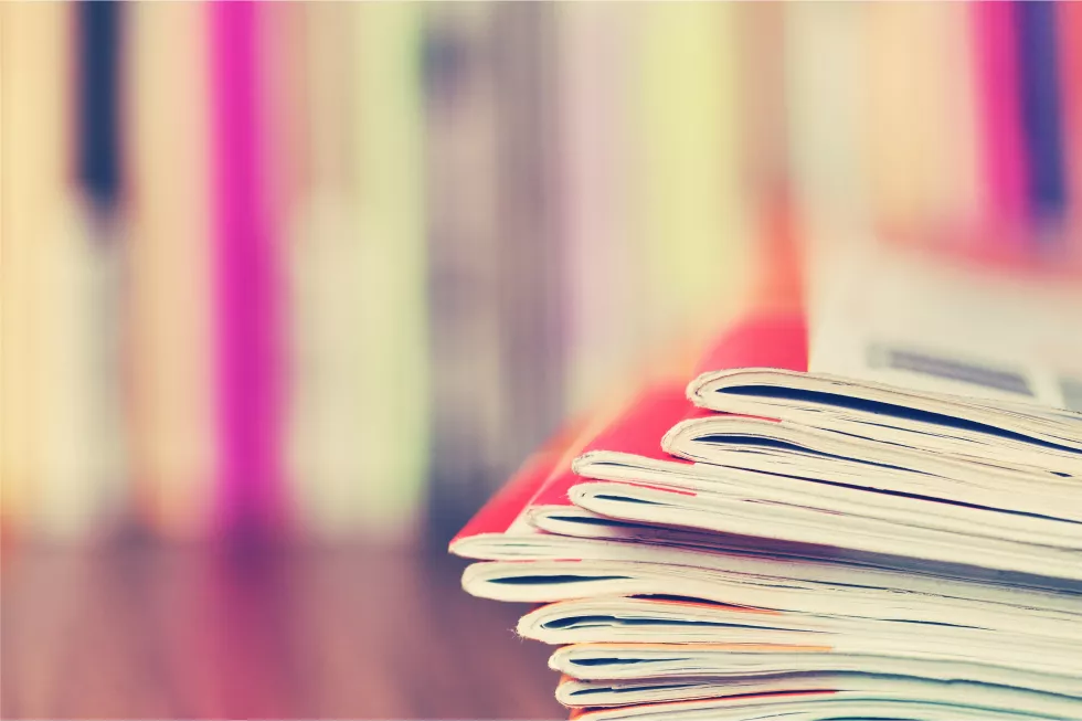 close-up-edge-colorful-magazine-stacking