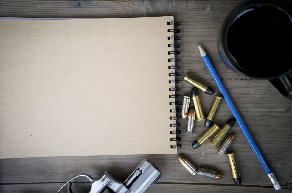 directly-shot-pistol-bullets-with-book-table