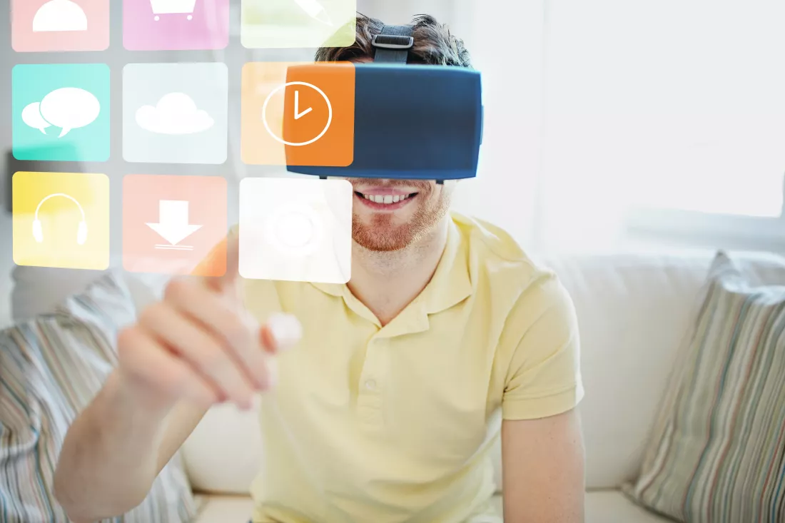 technology-gaming-media-entertainment-people-concept-happy-young-man-virtual-reality-headset-3d-glasses-with-computer-icons-home