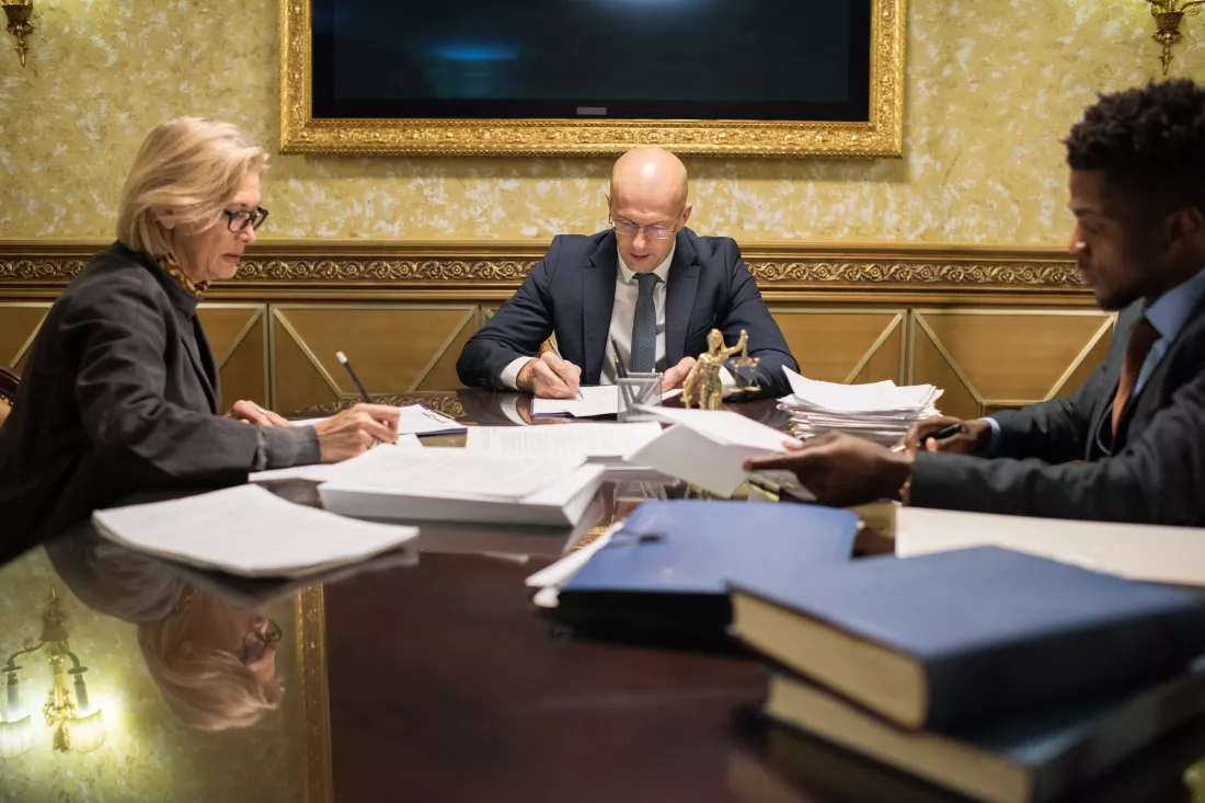 mature-young-intercultural-lawyers-working-with-papers