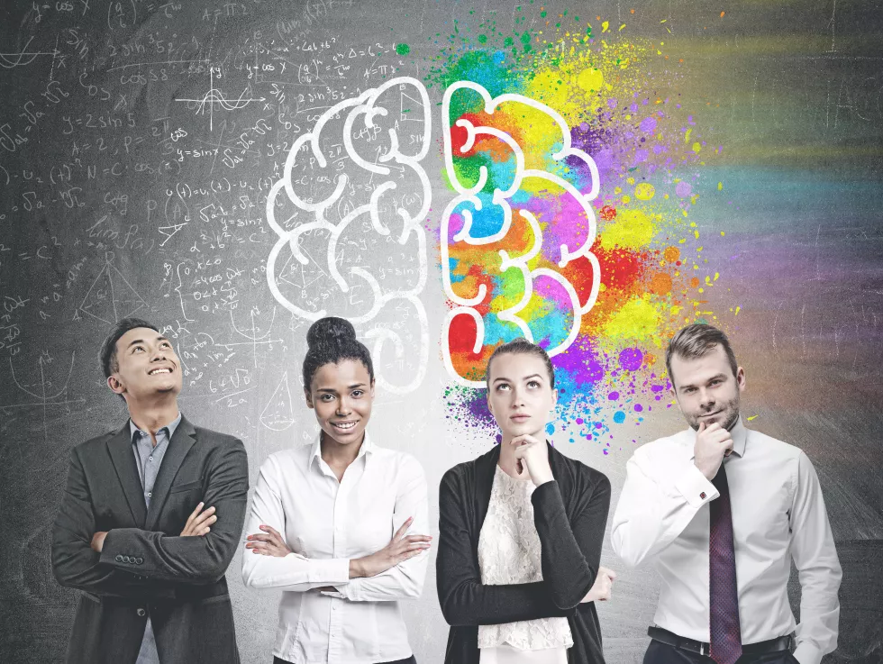 diverse-business-team-members-standing-row-blackboard-with-colorful-brain-sketch-formula