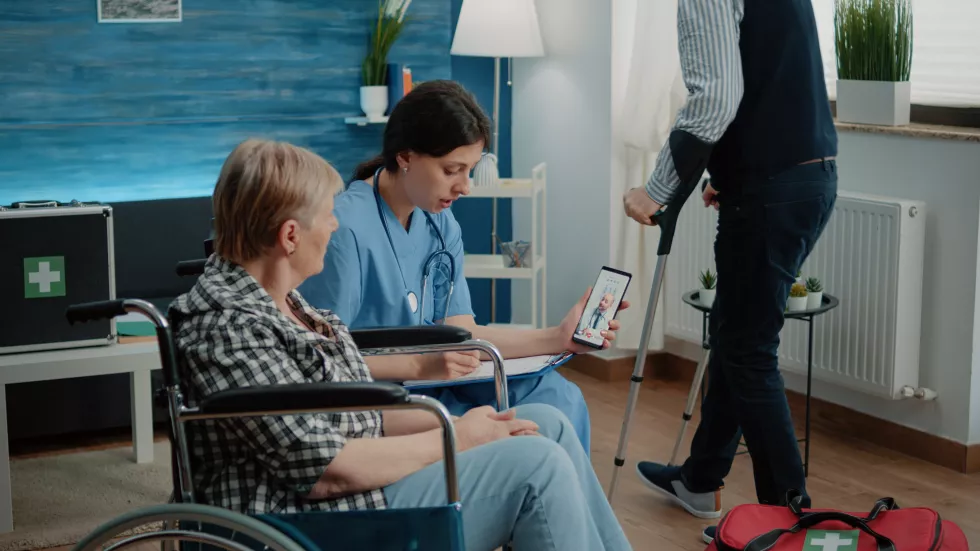 retired-woman-nurse-talking-doctor-video-call