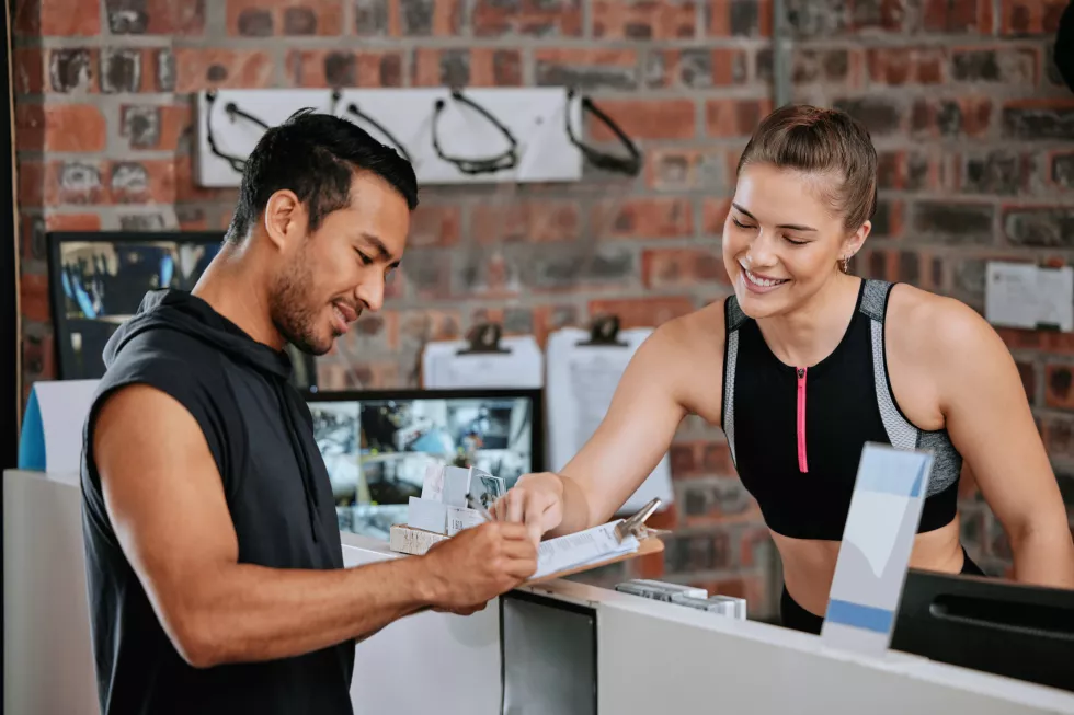 membership-athlete-woman-with-smile-gym-trainer-ready-workout-fitness-training-exercise-man-signature-morning-ambition-preparing-competition-health-club