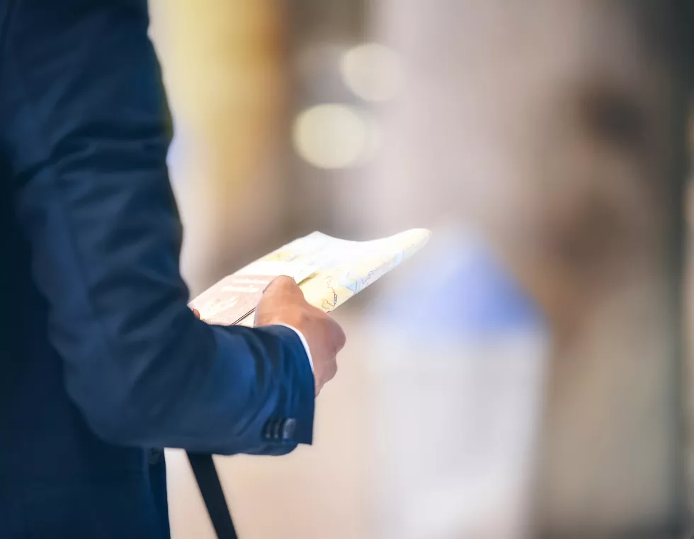 close-up-midsection-man-holding-document