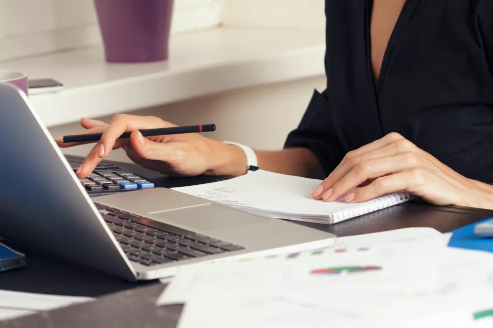 close-up-view-bookkeeper-financial-inspector-hands-making-report-calculating-checking-balance