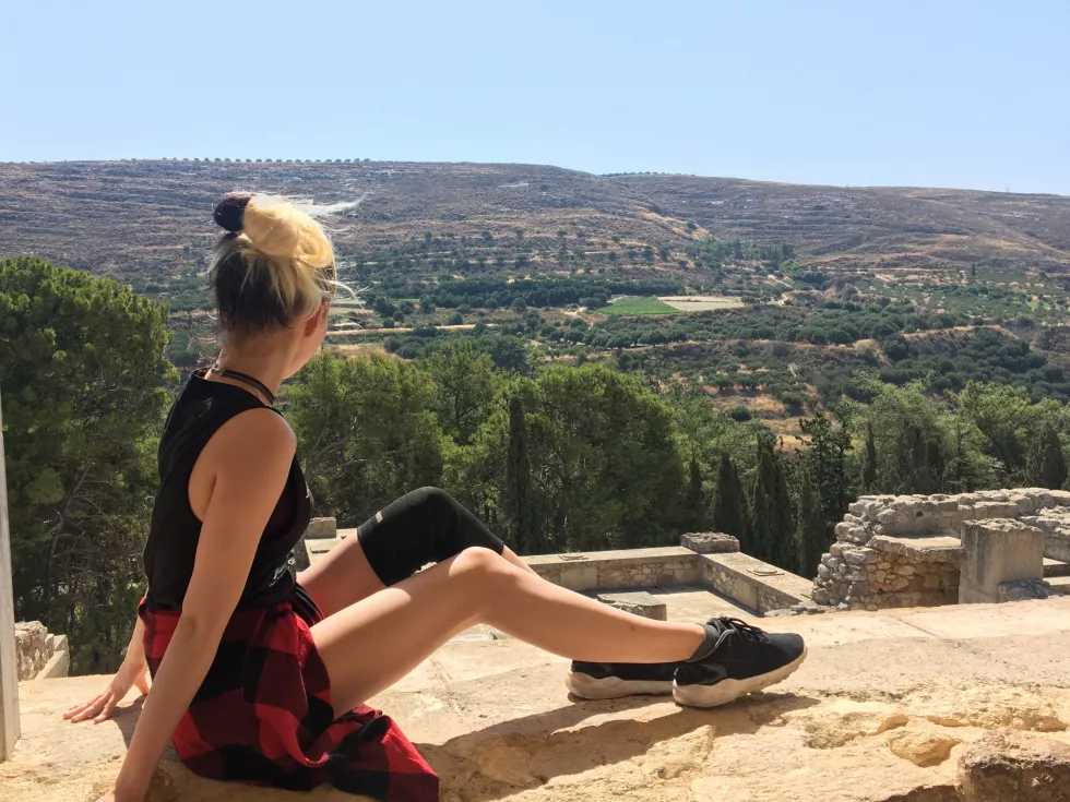 side-view-woman-sitting-old-ruin