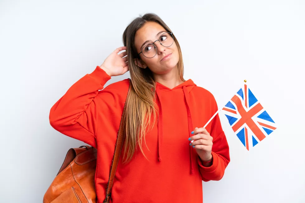 young-hispanic-woman-holding-united-kingdom-flag-isolated-white-background-having-doubts