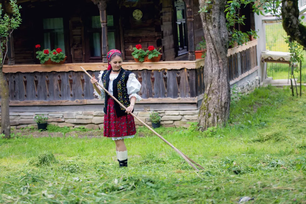full-length-woman-traditional-clothes-cleaning-yard