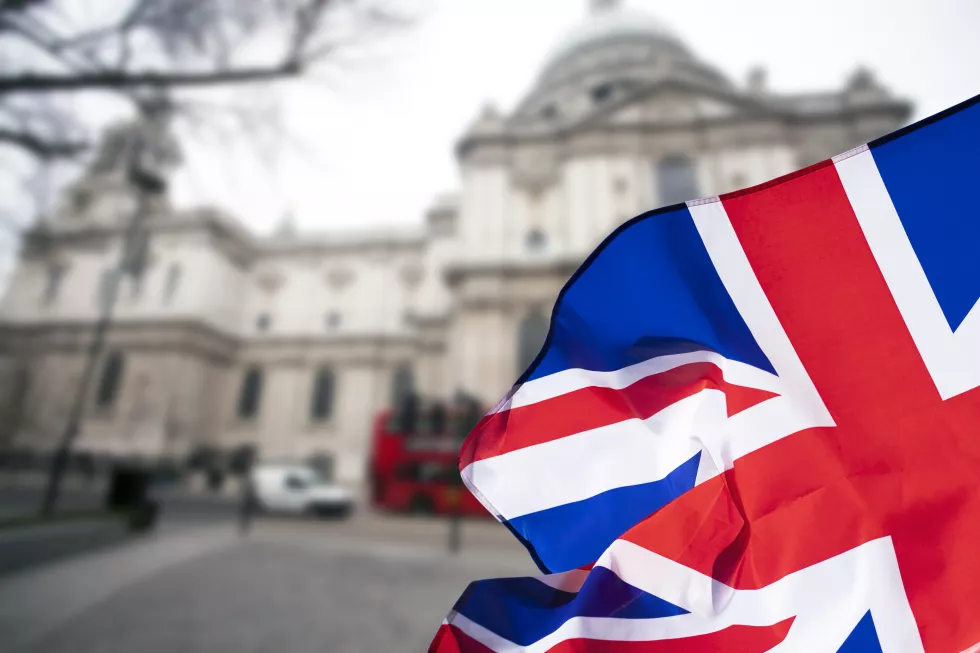 flag-against-blue-sky-city