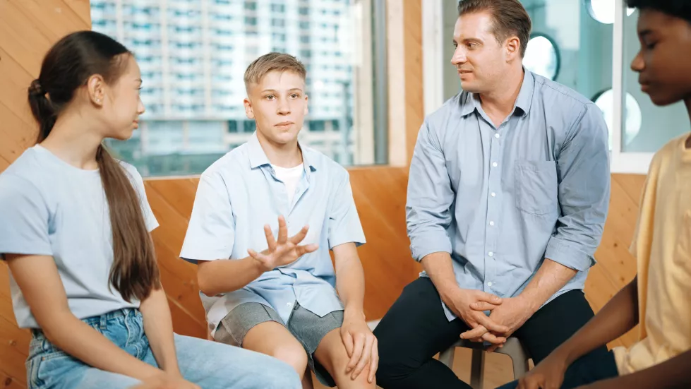 attractive-boy-sharing-experience-attend-group-therapy-edification