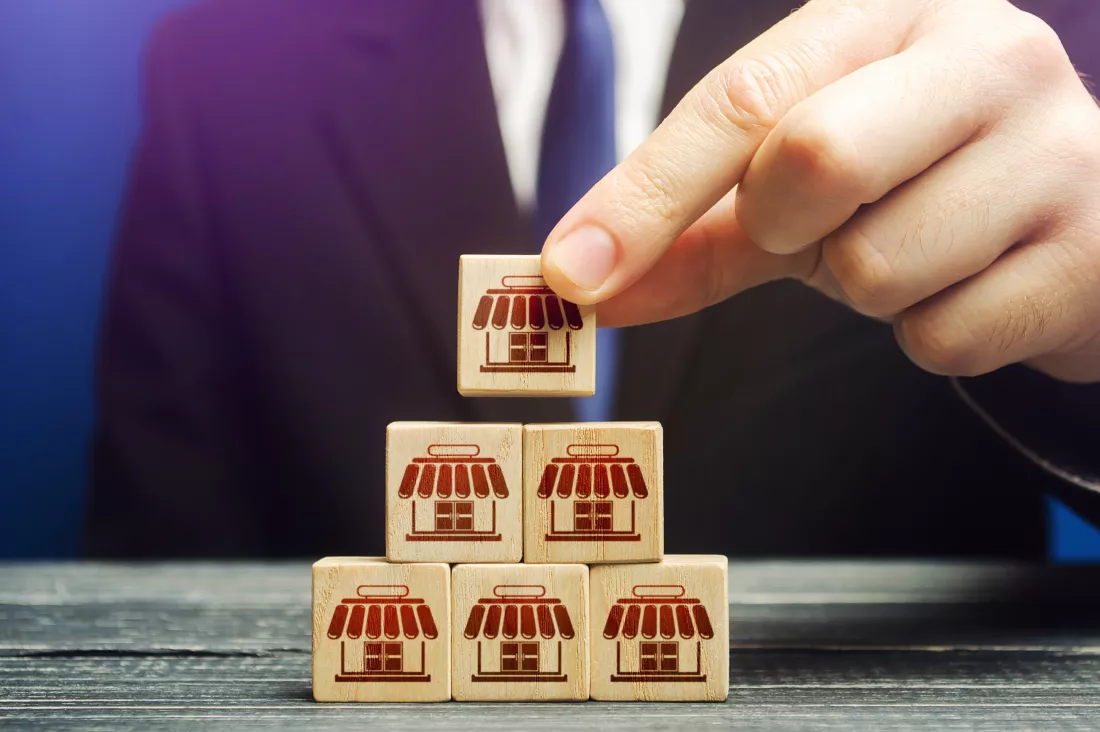 man-builds-pyramid-from-blocks-business-shops