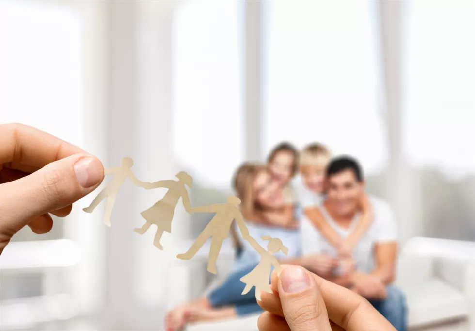 hands-with-family-paper-people-living-room-background