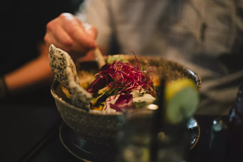 close-up-person-preparing-food-table
