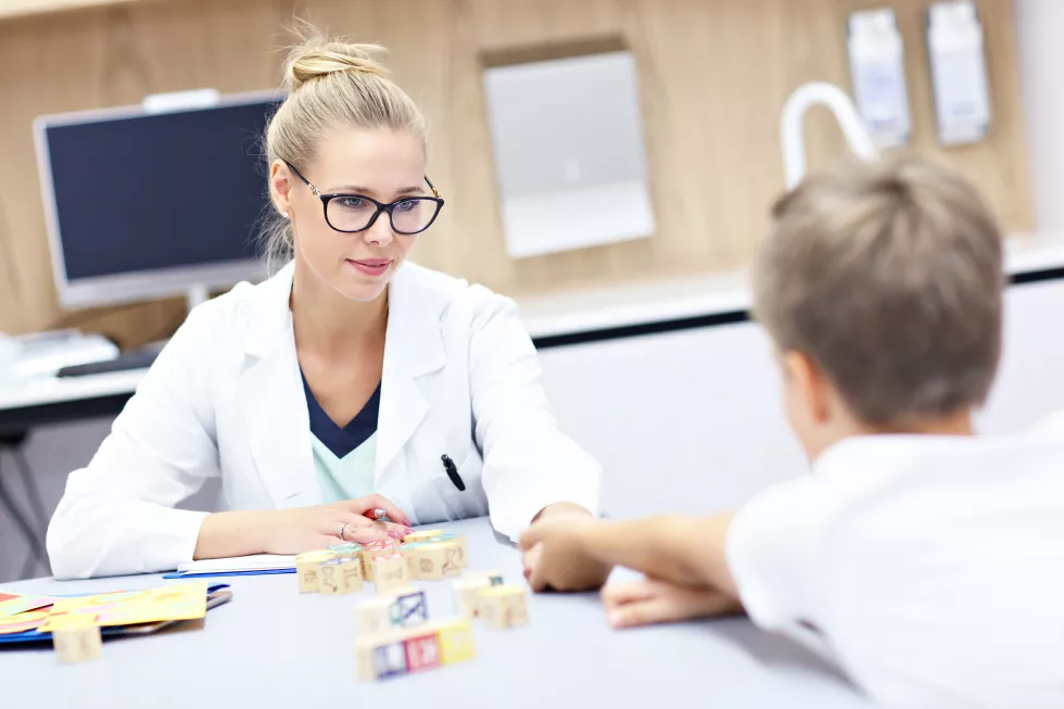 child-psychologist-working-with-young-boy-office-2