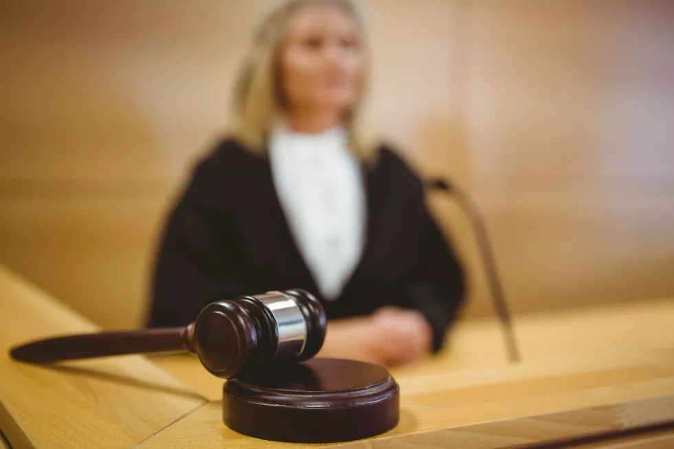 serious-judge-with-gavel-wearing-robes