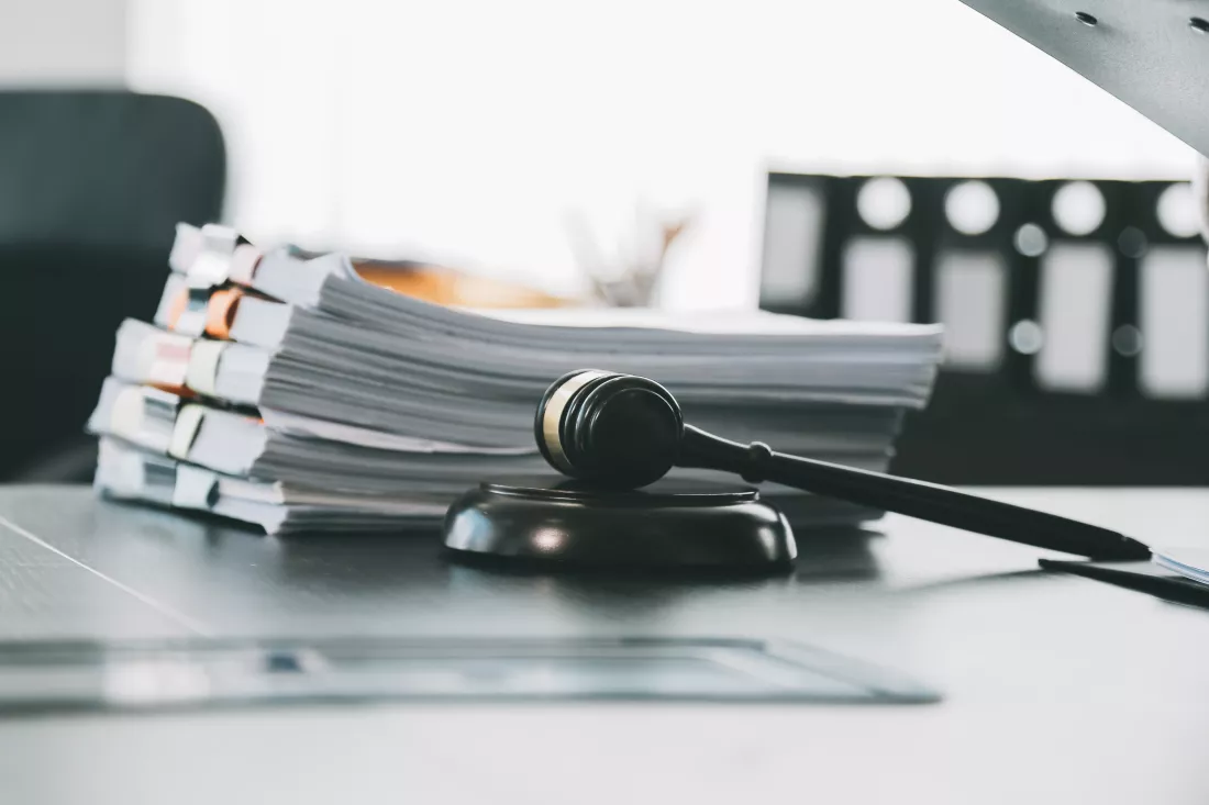 business-lawyers-discussing-contract-papers-with-brass-scale-desk-office-law-legal-services-advice-justice-law-concept-picture-with-film-grain-effect-2