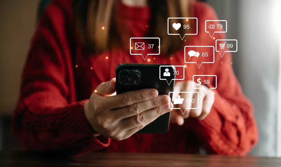 asian-woman-typing-smartphone-keyboard-with-laptop-computer-ofxasocial-media-marketing-virtual-icons-screen-conceptxa