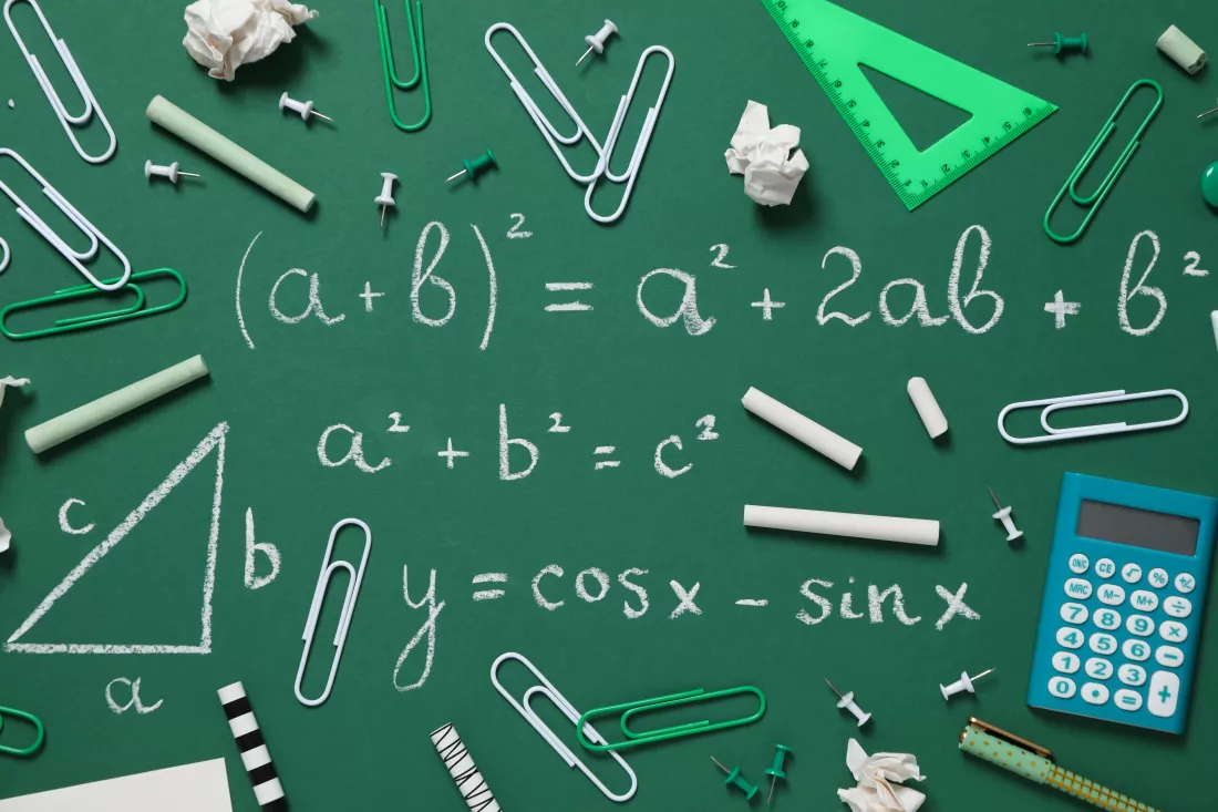 school-supplies-school-board-with-formula-written-chalk