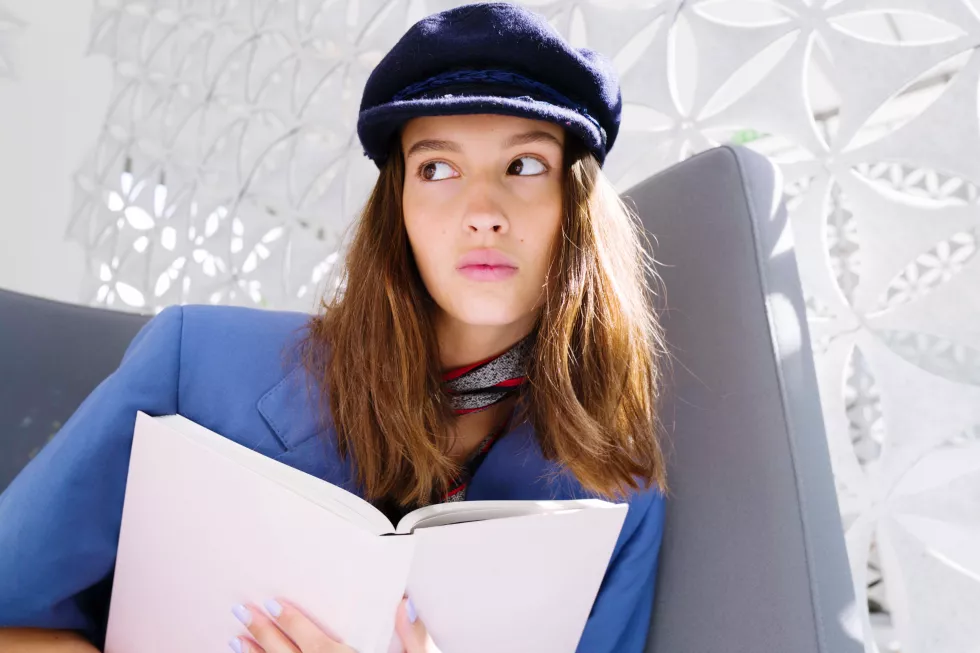 young-woman-library-with-books