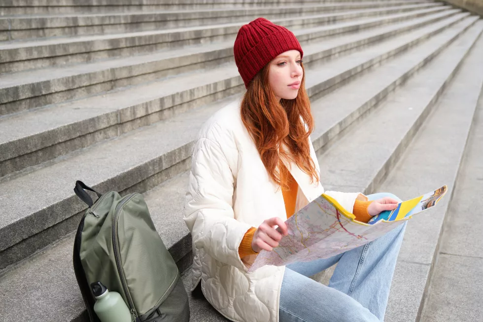 tourism-lifestyle-concept-young-redhead-woman-looking-city-map-plans-route-sightseeing