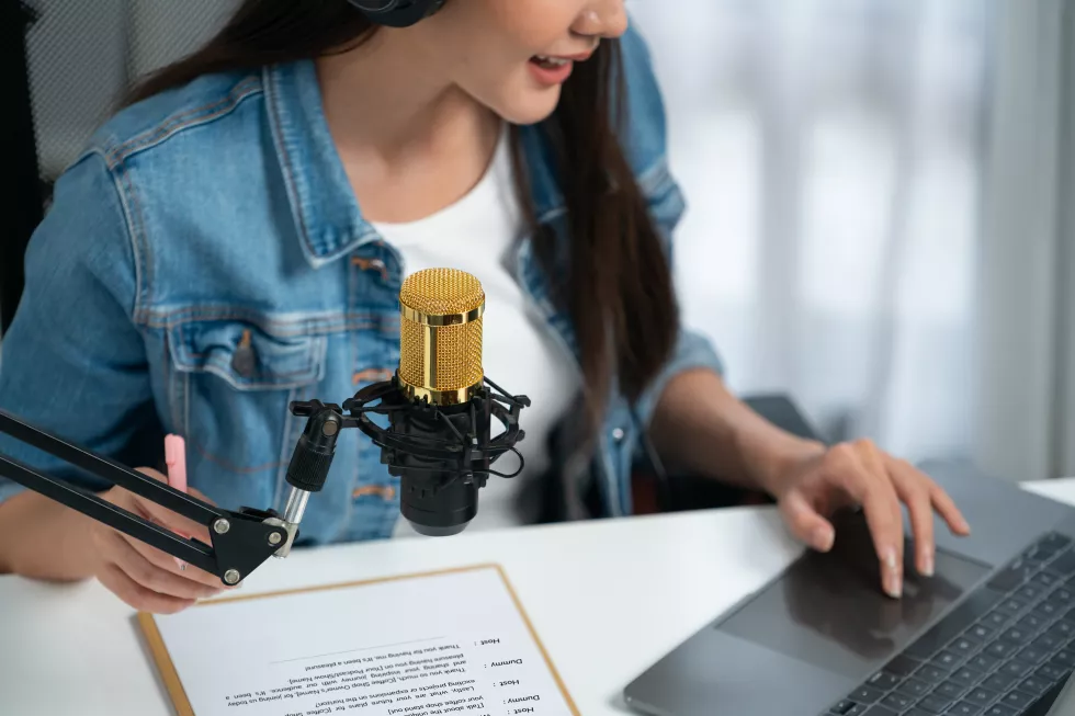 host-channel-asian-broadcast-wearing-headsets-with-script-note-stratagem