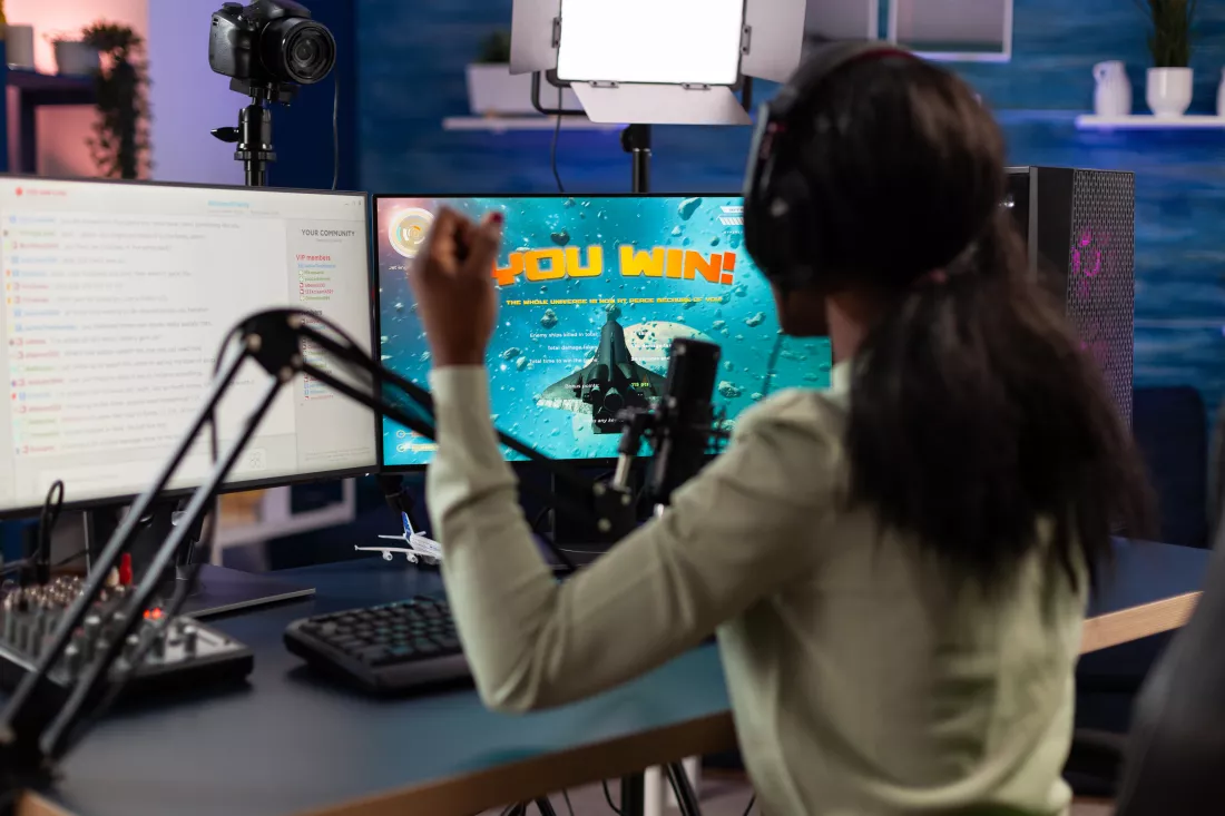 excited-happy-esport-woman-playing-online-videogames-winning-space-shooter-tournament-successful-gamer-talking-with-remote-players-streaming-chat-using-rgb-keyboard-home-studio