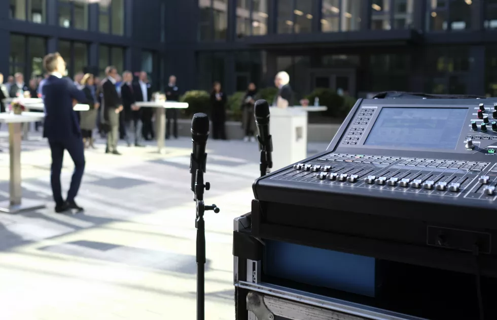outdoor-business-event-microphone-audio-equipment-foreground