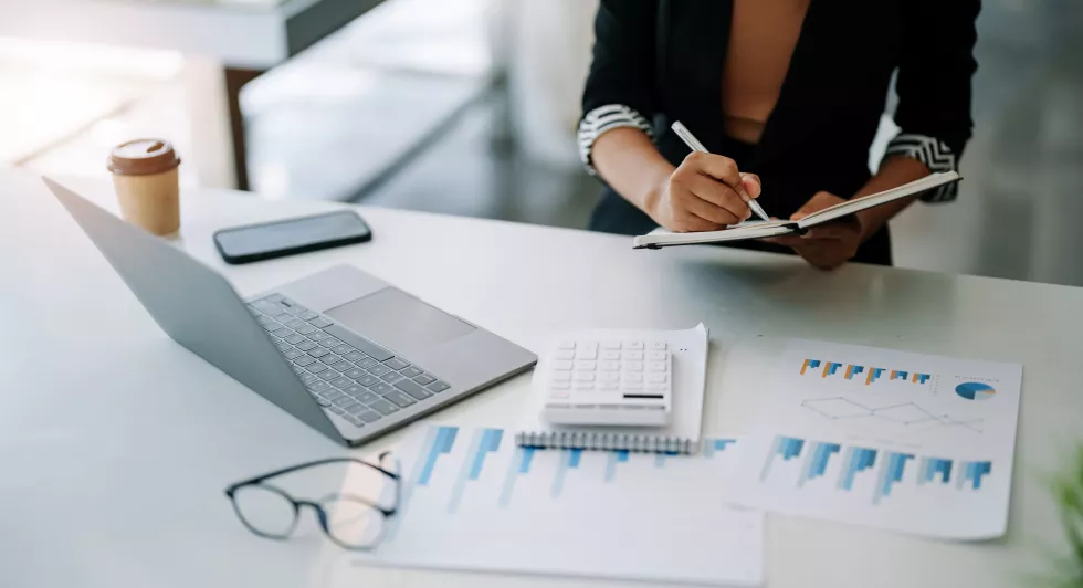 midsection-businessman-working-table