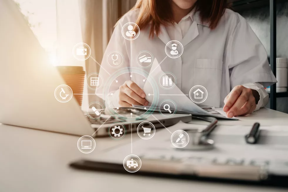 medicine-doctor-hand-working-with-report-laptop-computer-interface-as-medical-network-concept