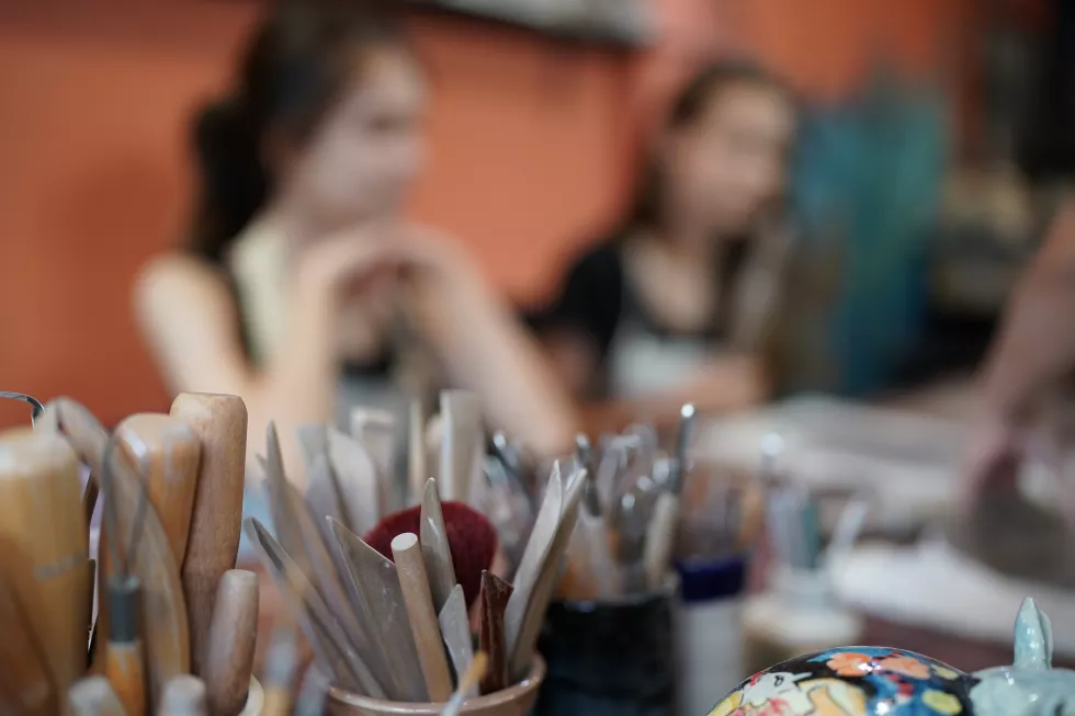 young-woman-hand-potter-making-clay-vase-pottery-workshop-business-owner