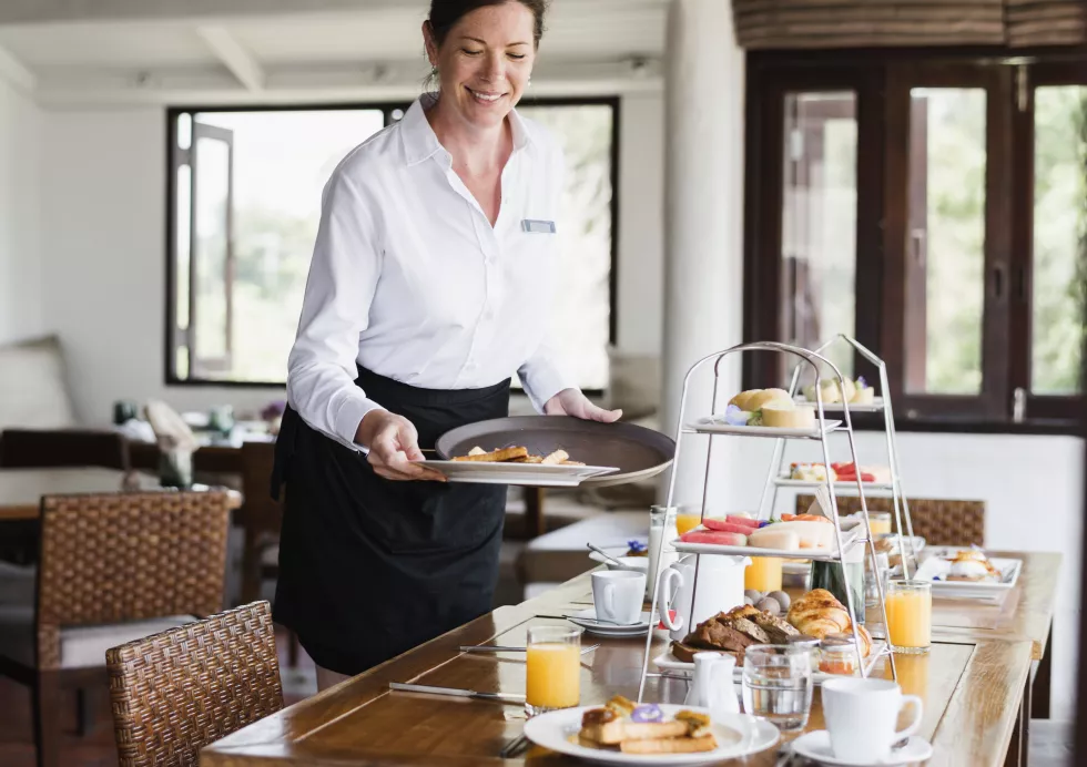 hotel-waitress-serving-food