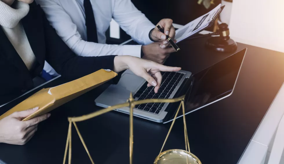 male-lawyer-working-with-contract-papers-wooden-gavel-tabel-courtroom-justice-law-attorney-court-judge-concept