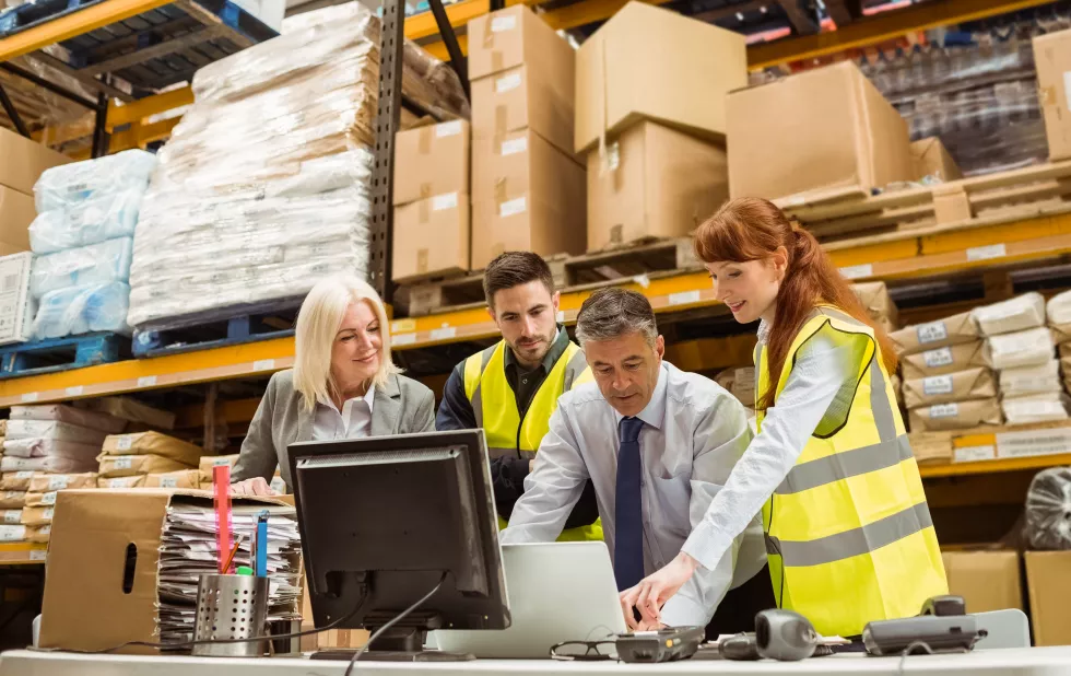 warehouse-managers-worker-working-laptop
