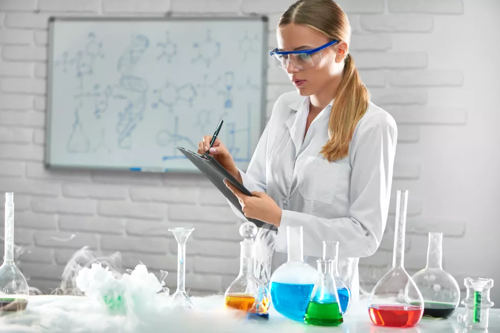 gorgeous-female-chemist-working-lab-testing-samples