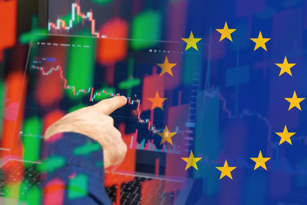 european-union-downtrend-economy-world-crisis-man-hand-shows-decreasing-candle-st