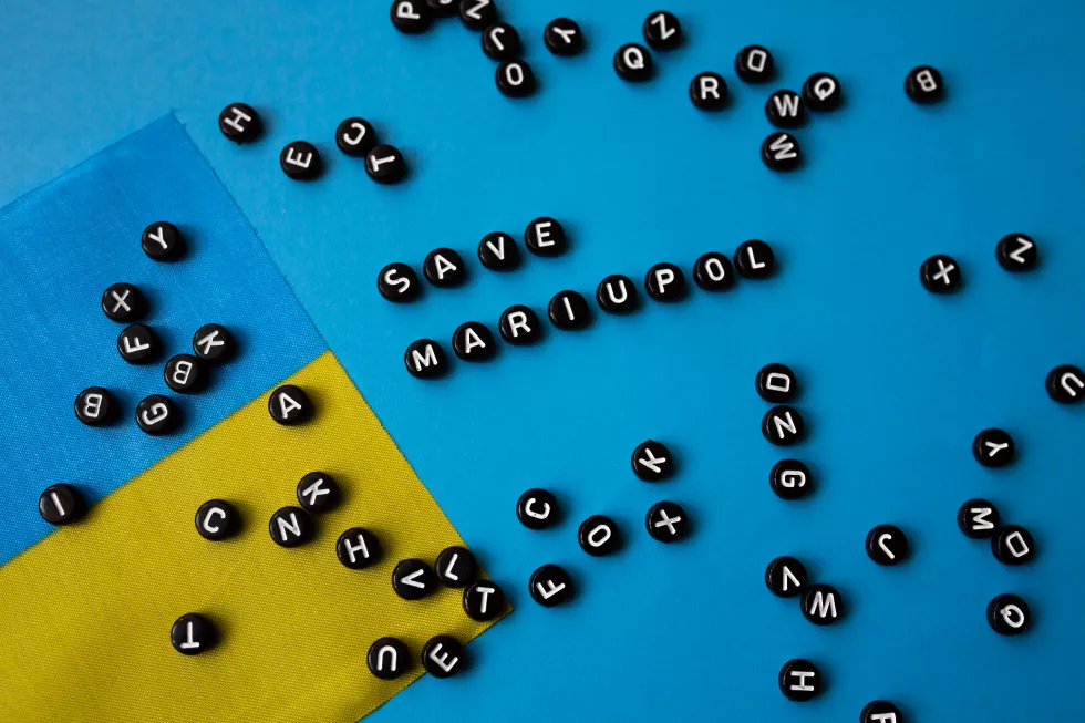 save-mariupol-background-ukrainian-flag-concept-stop-ongoing-conflicts