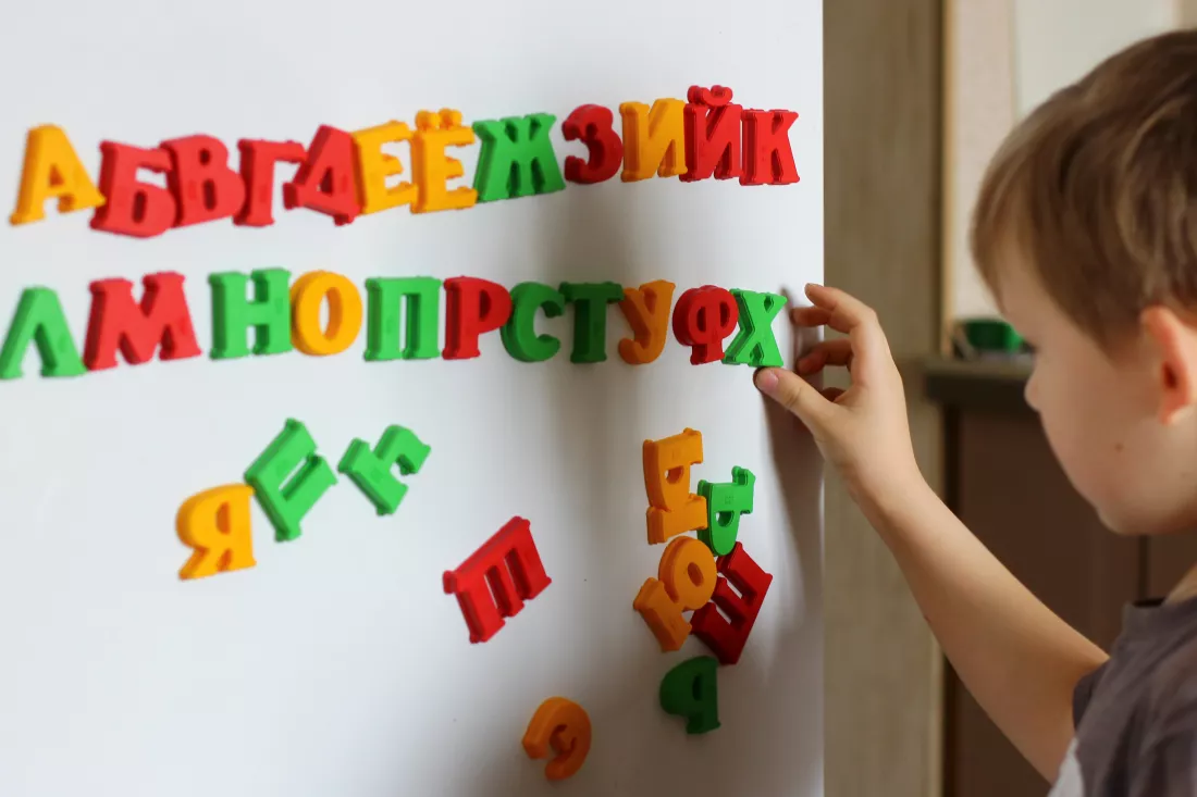child-is-playing-with-letters-alphabet-intellectual-play-preschool-primary-education