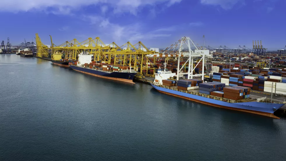 logistic-container-ship-from-sea-port-warehouse-with-working-crane-bridge-delivery-containers