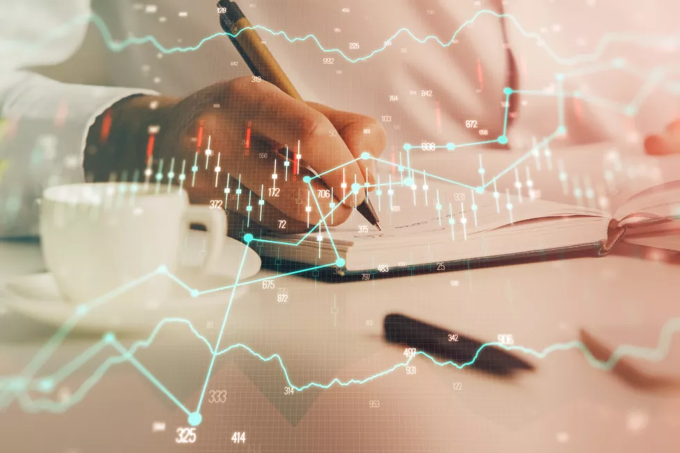 double-exposure-mans-hands-writing-notes-stock-market-with-forex-chart