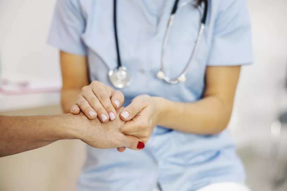 close-up-doctor39s-hands-holing-patient39s-hand-comforting-her-hospital