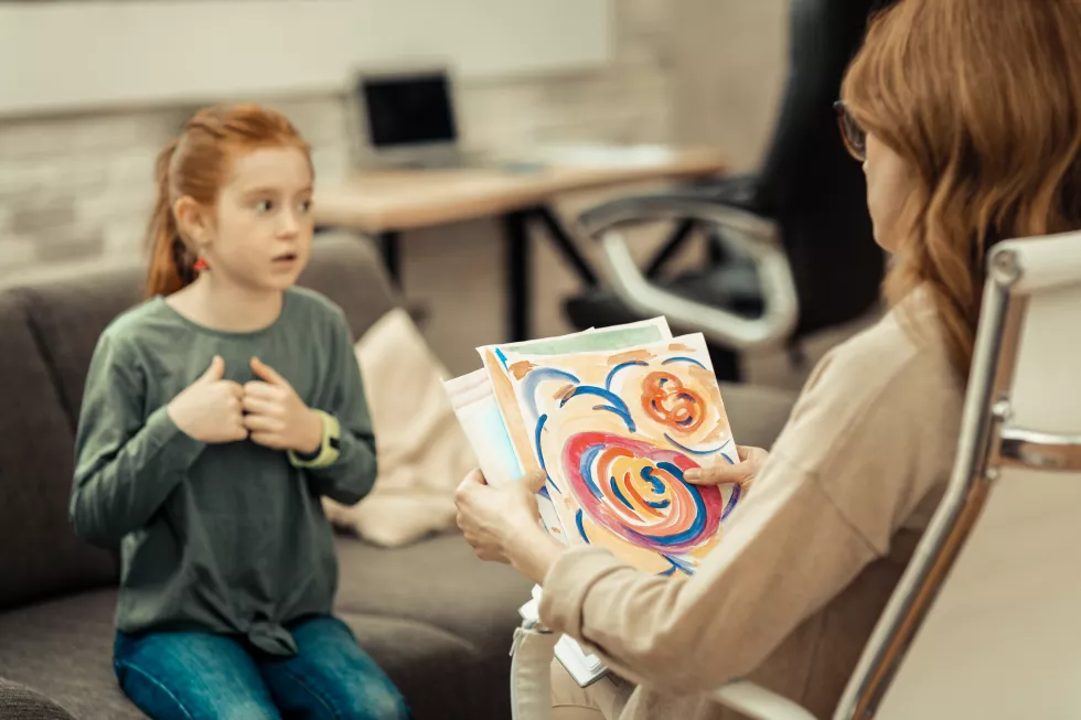 childs-painting-selective-focus-professional-female-psychologist-holding-childs-painting