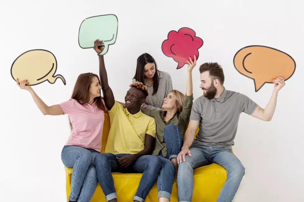 friends-looking-each-other-holding-chat-bubble