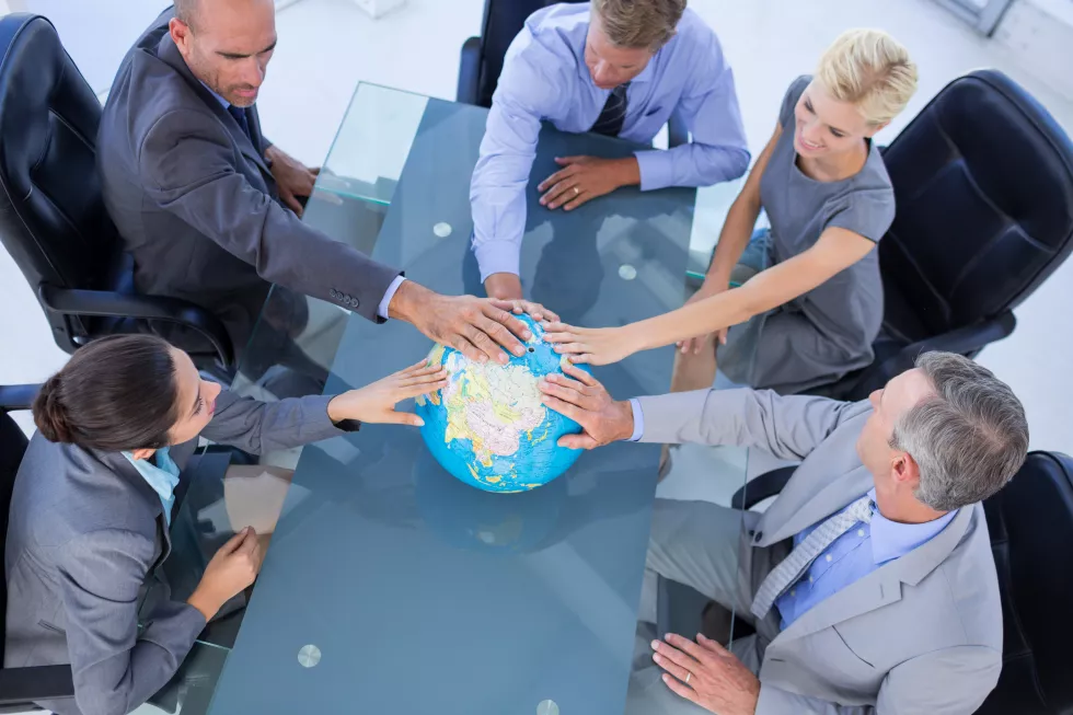 business-people-touching-globe