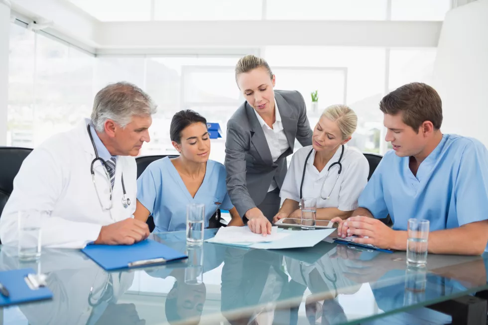 team-doctors-businesswoman-having-meeting